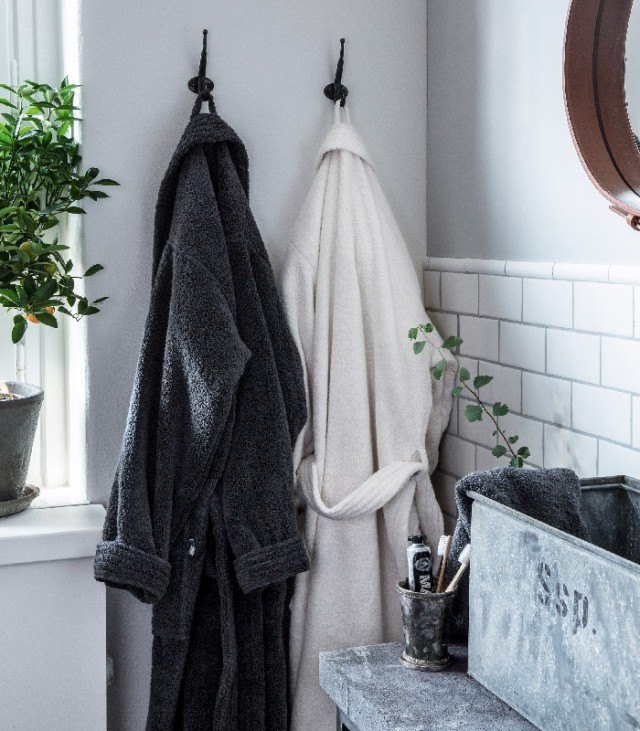 bathrobes hanging in bathroom