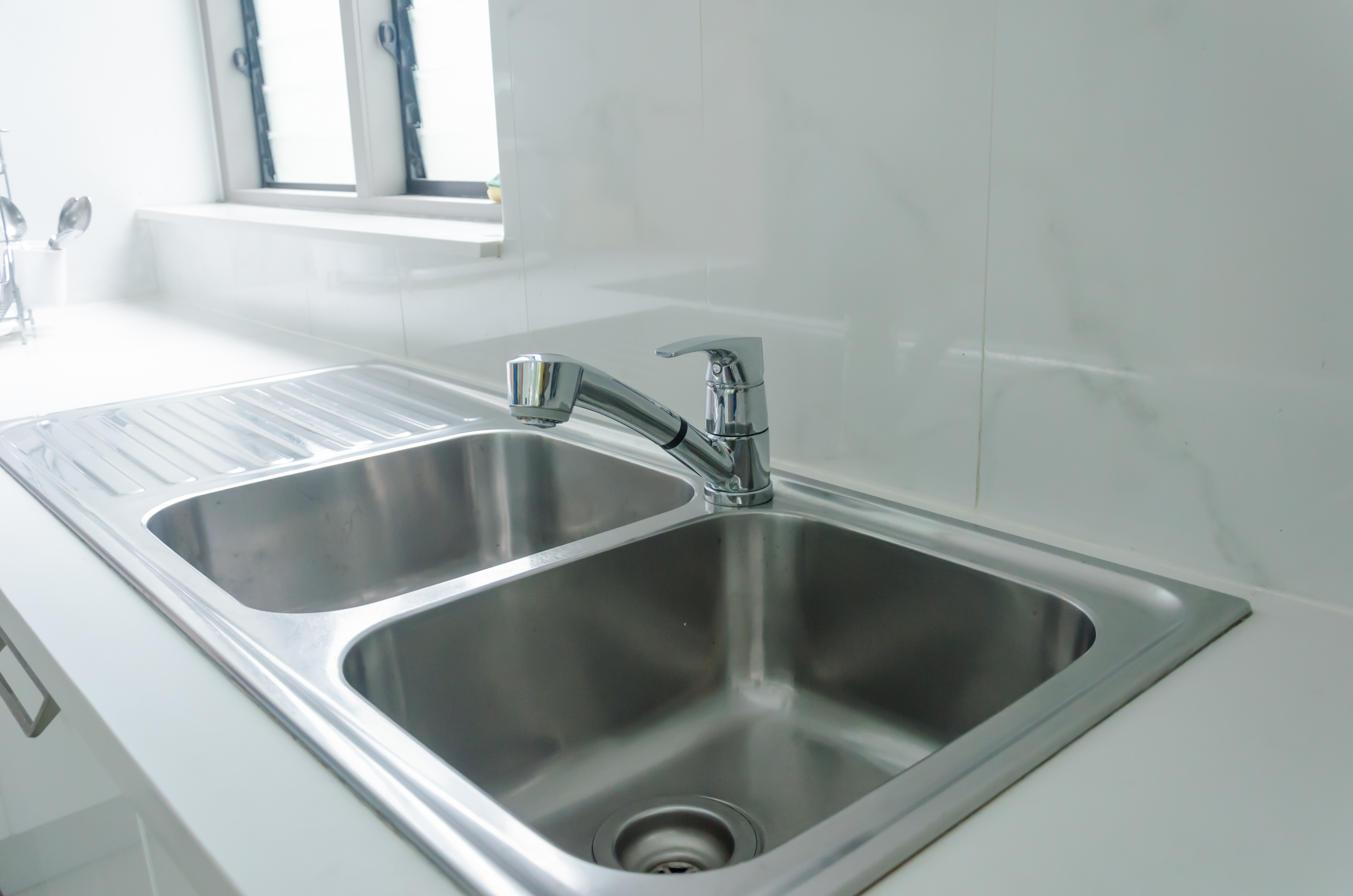 How to Unclog a Double Kitchen Sink With Standing Water