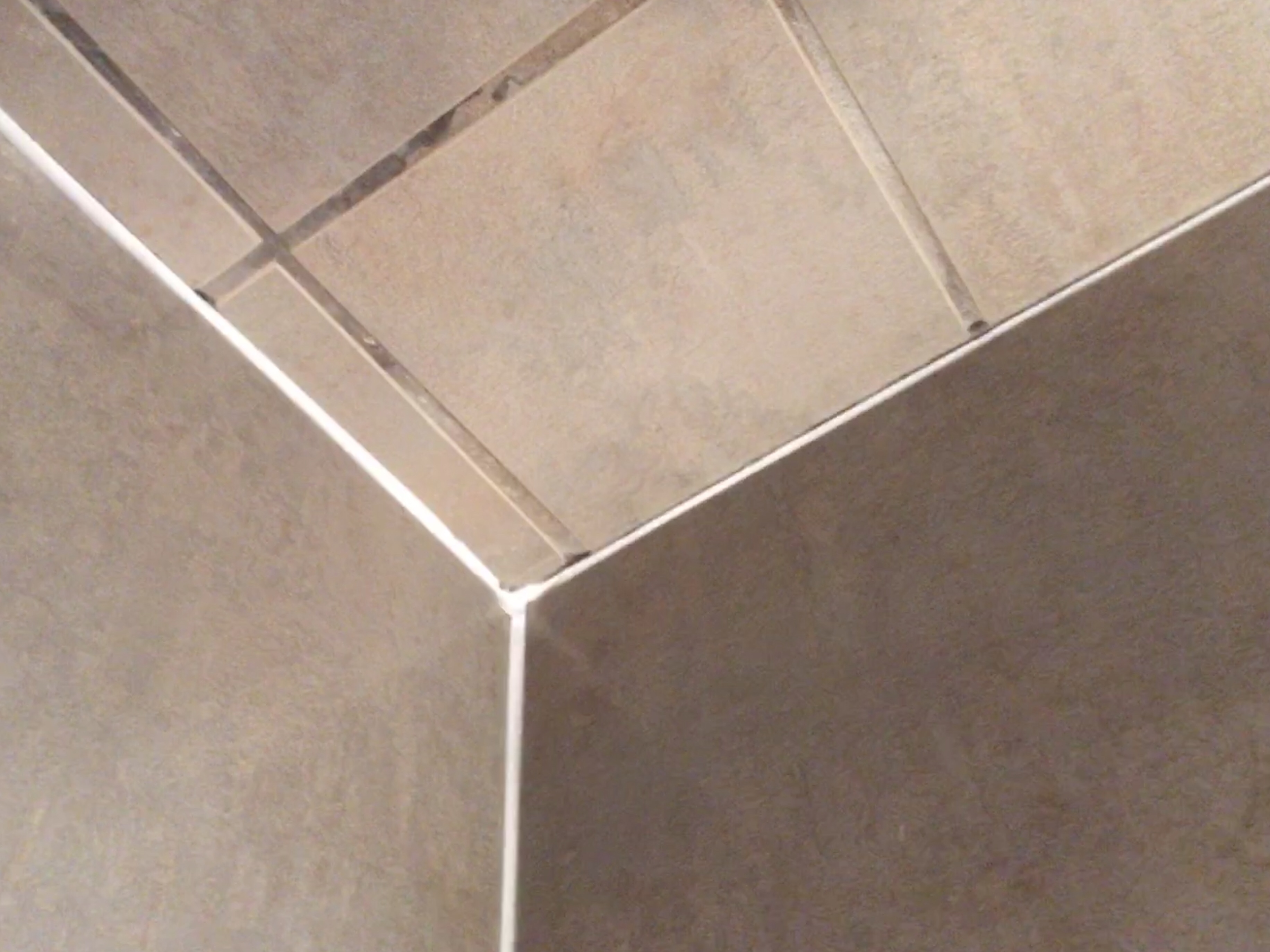 Remove old deals caulk from tile