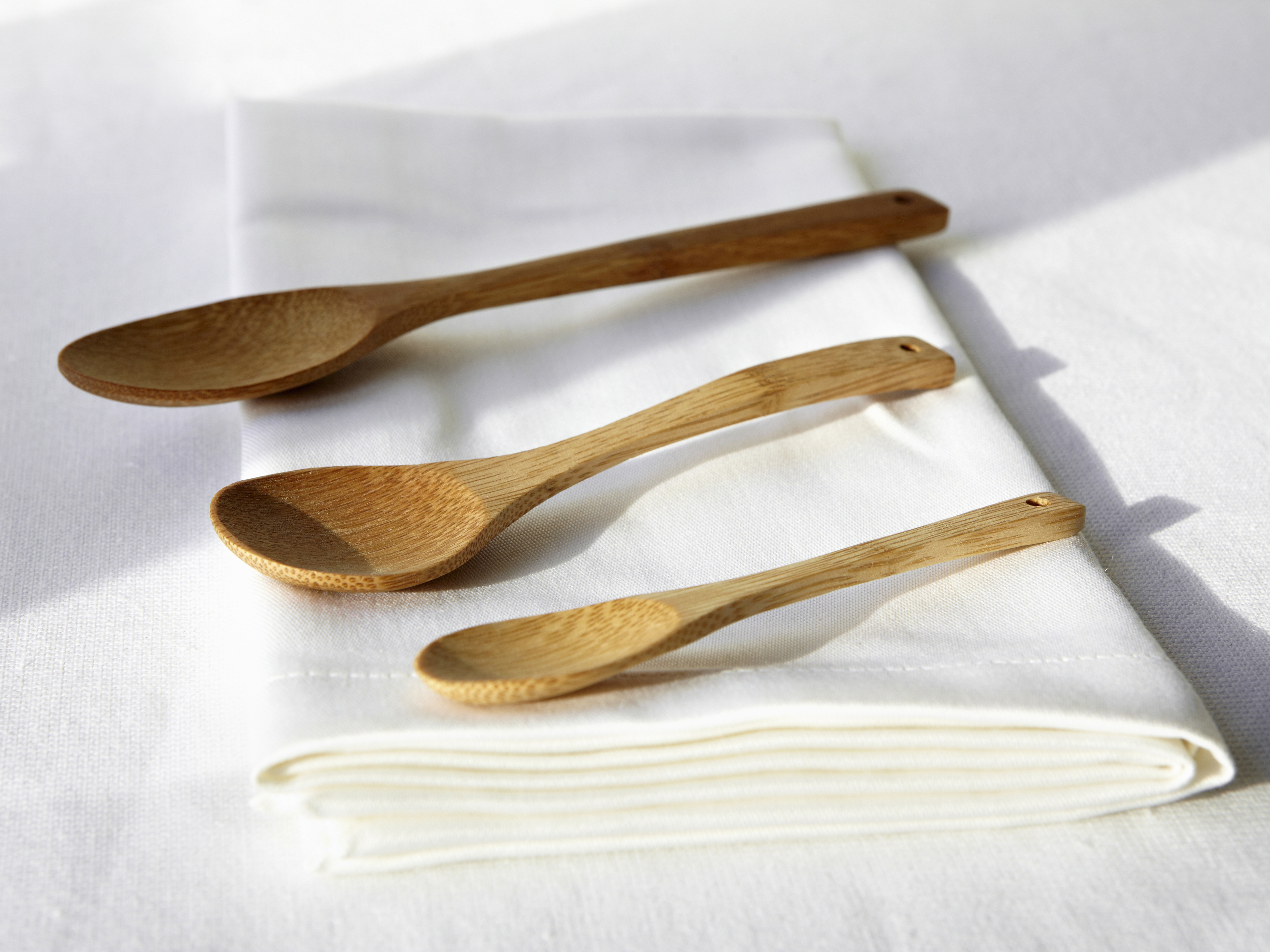 Wood spoons treated with walnut oil, mineral oil, coconut oil and