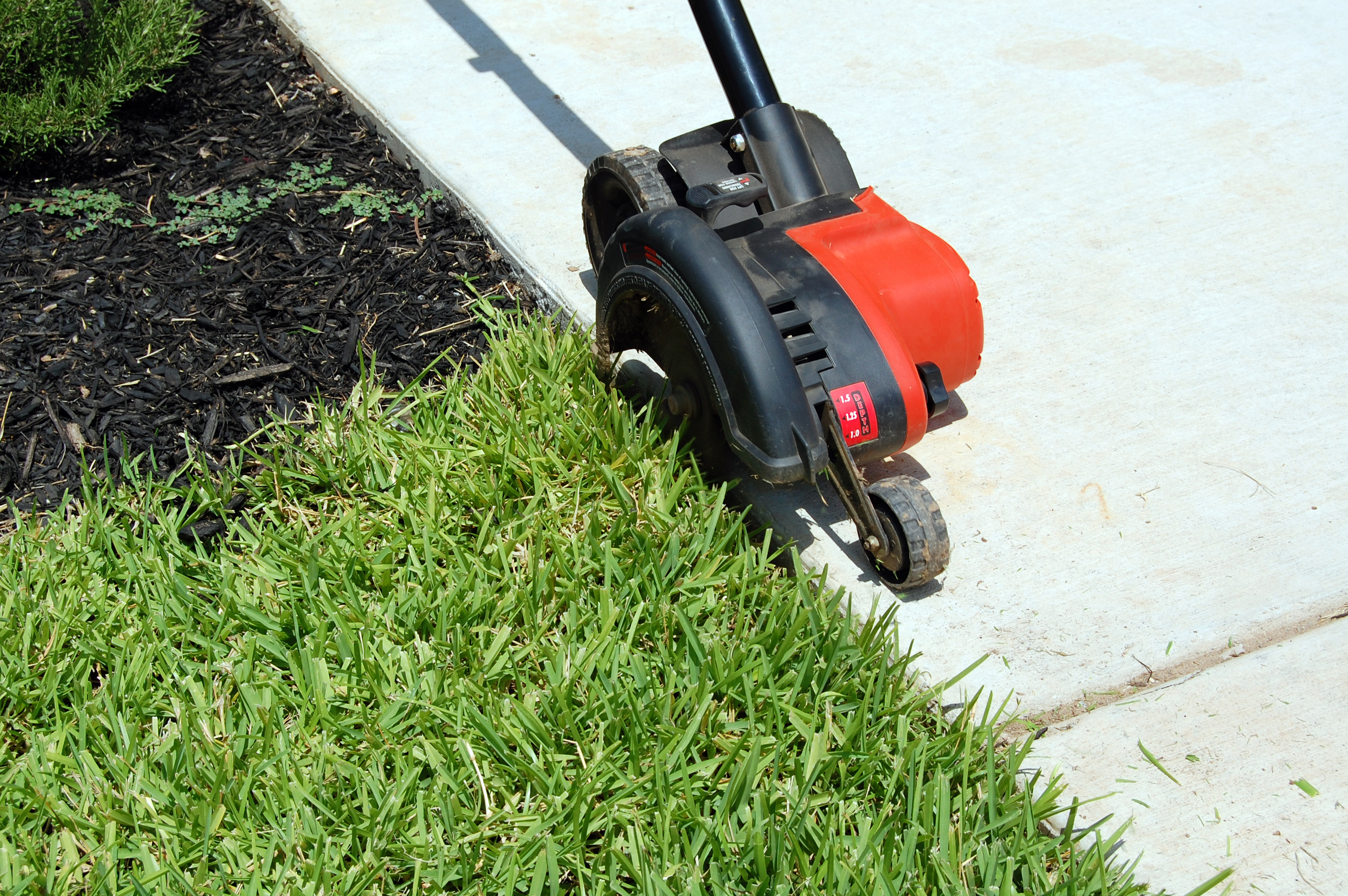 Image of Rolling lawn edger in use on large lawn