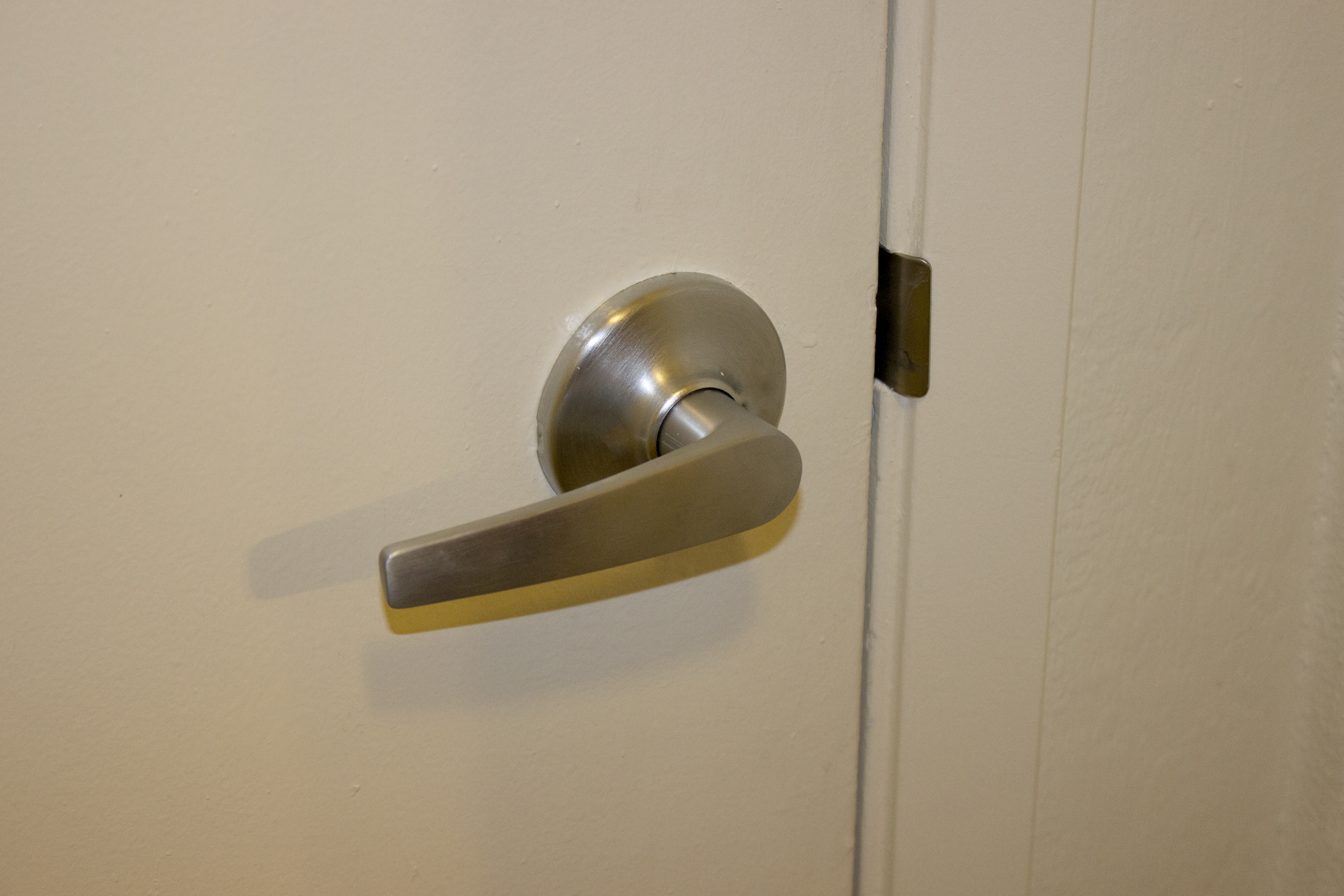 How to Remove a Lever Door Handle Without Screws