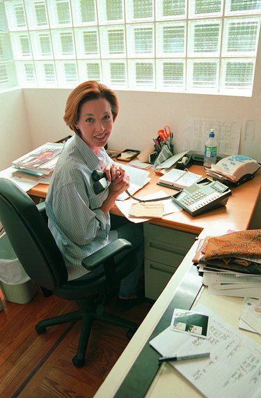 Woman on phone in home office