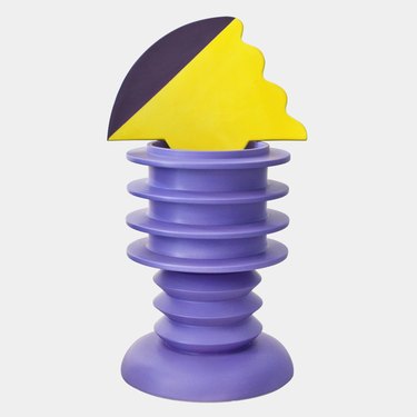 sculptural piece with purple base and yellow top designed by Marco Zanini