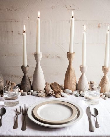 farmhouse table centerpiece idea with wooden candleholders and taper candles