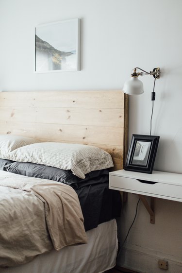 bedroom with wood headboard idea for minimalist decorating on a budget