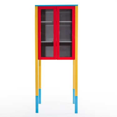 cabinet with bright red door frames and yellow legs with blue tips designed by George Sowden