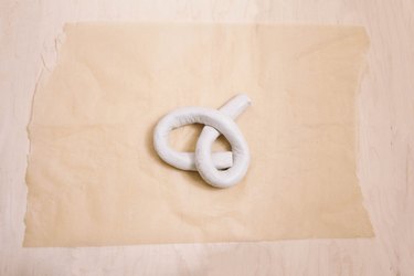 Shaping air dry clay into a knot shape