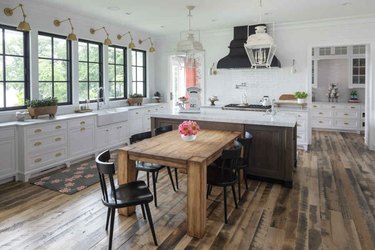 Rustic wood and quartz T-shaped kitchen island in farmhouse kitchen