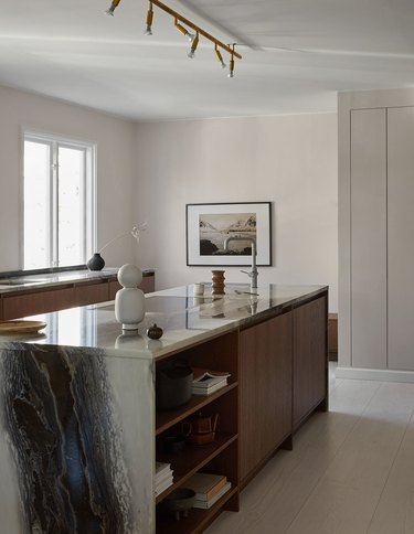 espresso kitchen island with waterfall marble countertop