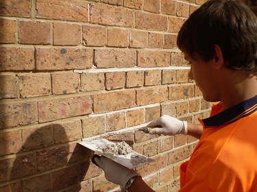 Tuckpointing brick repair.