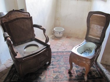 photo of two wooden French bidets fitted with porcelain bowls