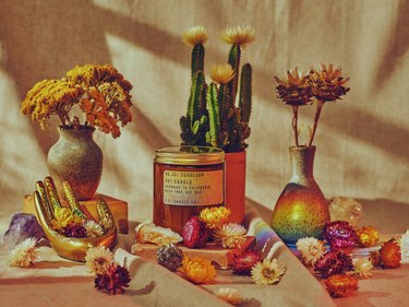 dreamy P.F. Candle Co. product shot with flowers and cacti