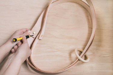 Adding brass brackets to leather