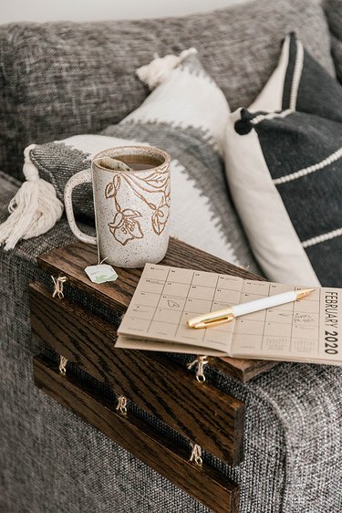 Turn wood slats into a portable tabletop for your sofa arm.