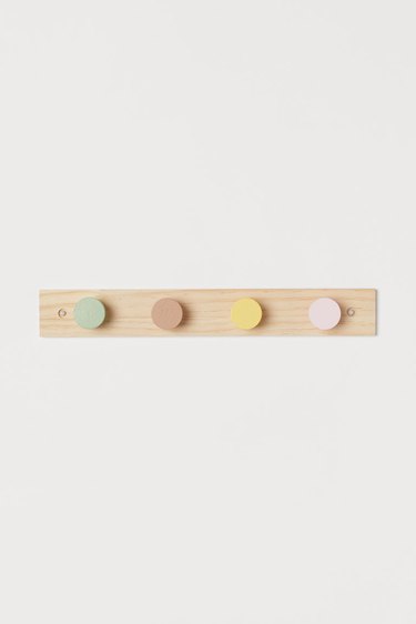wood hanger with colorful knobs