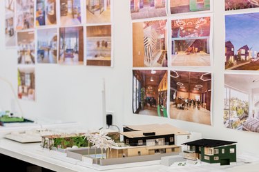 architectural models of modern homes on white desk