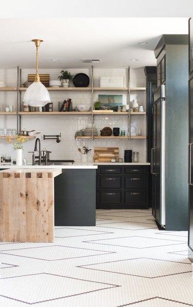 black and white kitchen floor with penny tile ini a diamond pattern