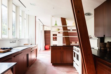 Kitchen of midcentury home by John Lautner with wood cabinetry