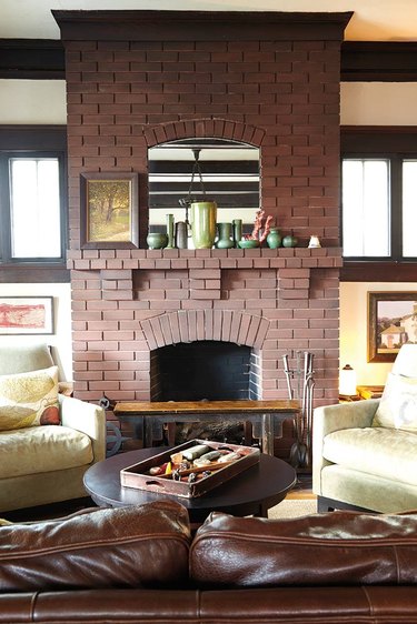 original red brick Craftsman style fireplace in living room