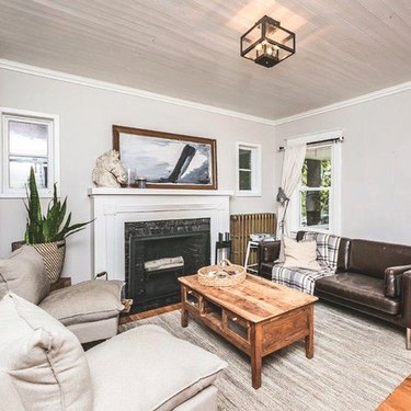 white and black Craftsman style fireplace in living room