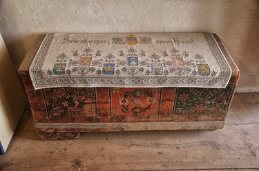 Wooden hope chest featuring elaborate carvings in the Hărman fortified church