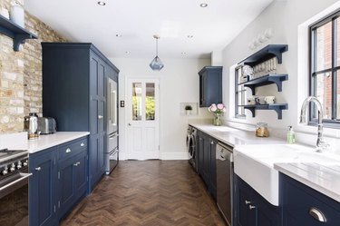 blue shaker-style cabinets with white farm sink