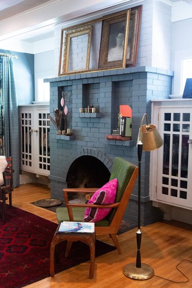 painted brick Craftsman style fireplace in living room