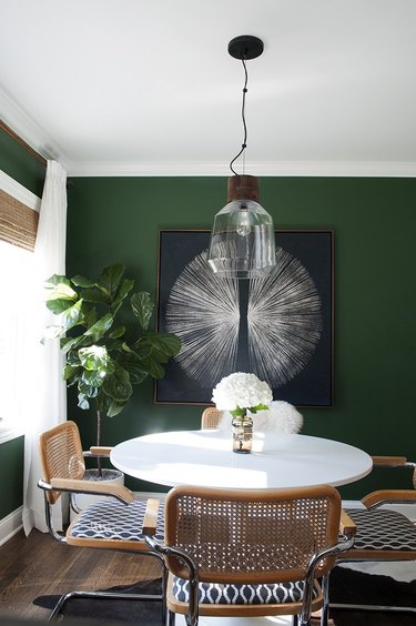 dining room design idea with green walls to divide space