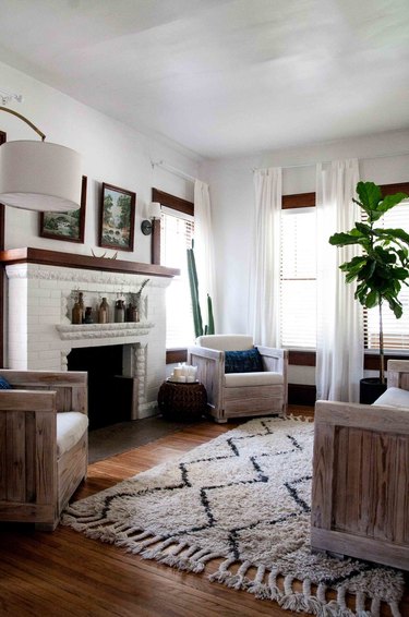 Craftsman living room with original fireplace and vintage artwork