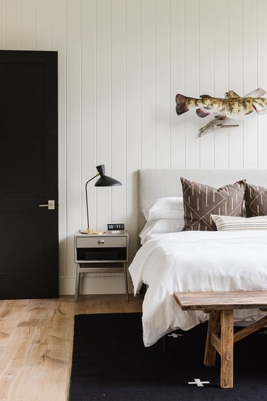 Scandinavian farmhouse bedroom with white shiplap and Scandinavian decor details