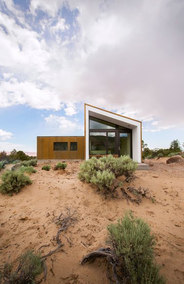 Desert style home with modern design elements and sloped roof