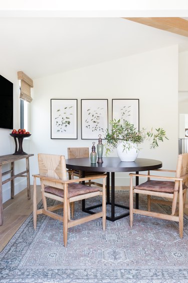 A breakfast nook with woven chairs