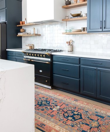 desert themed kitchen with blue cabinets and tile backsplash