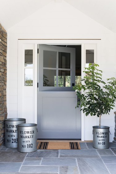 gray Dutch Craftsman-style door, bluestone patio