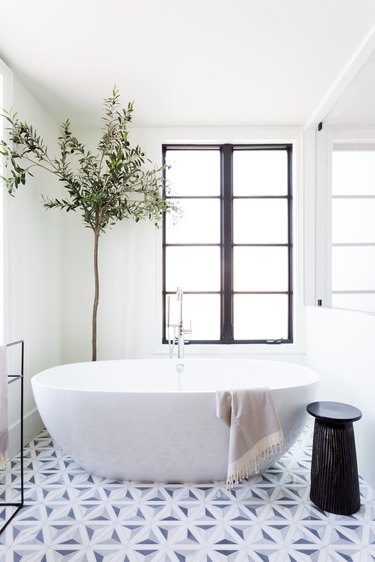 A freestanding bath tub in the master bath