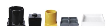 five serving dishes in black, yellow, gray and white