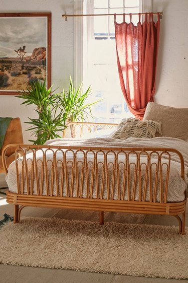 bohemian bedroom with rattan bed