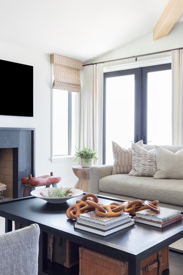 A carefully curated coffee table in a living room