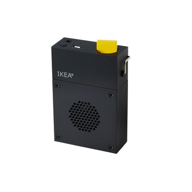 black portable speaker with yellow switch
