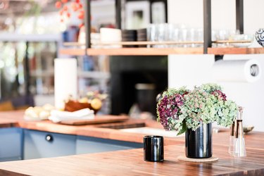focus on flowers on a wood countertop