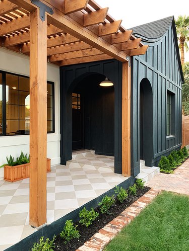 Craftsman front porch in modern styling with pergola and black exterior