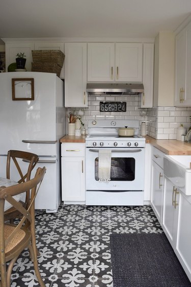 simple white kitchen with deco gray patterned tile