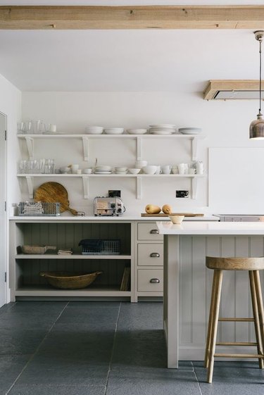 gray country farmhouse kitchen with limestone floor