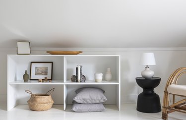 White shelves next to black small side table