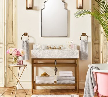 brass bathroom vanity with marble sink