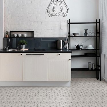 kitchen with geometric patterned floor and white cabinets