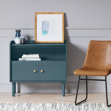 blue two-door accent chest with gold hardware