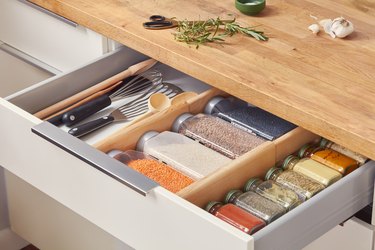 kitchen drawer showing utensils and spices