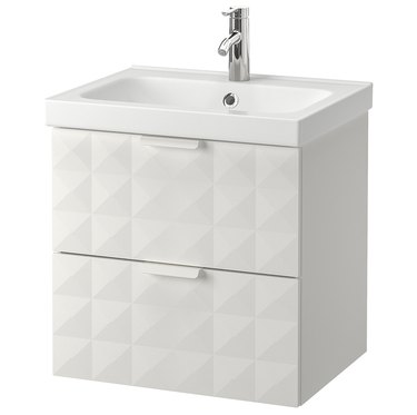 White small bathroom vanity with geometric details and sink